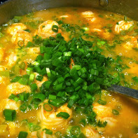 Etouffee green onions are added